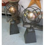 GARDEN ARMILLARY SPHERES, in metal on fixed bases, 97cm H.