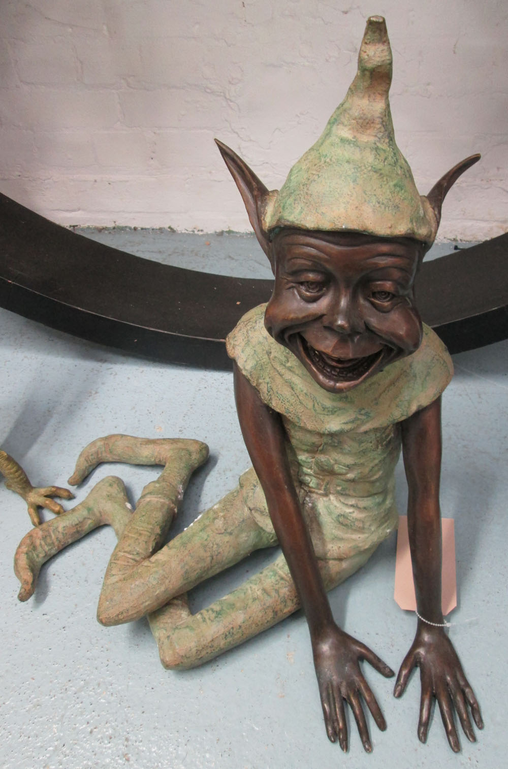 BRONZE, of a seated goblin, 54cm H.