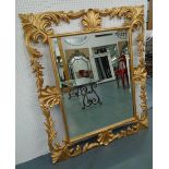 WALL MIRROR, Florentine style, with a gilt frame and bevelled plate, 140cm W x 122cm H.