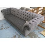 CHESTERFIELD SOFA, two seater, in buttoned grey fabric on turned castor supports, 275cm L.