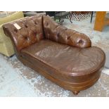 CHAISE LONGUE, in tanned buttoned leather on turned supports, 172cm L.