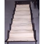 AN OFFICERS CAMPAIGN BED IN OAK FRAME WITH CANVAS BED