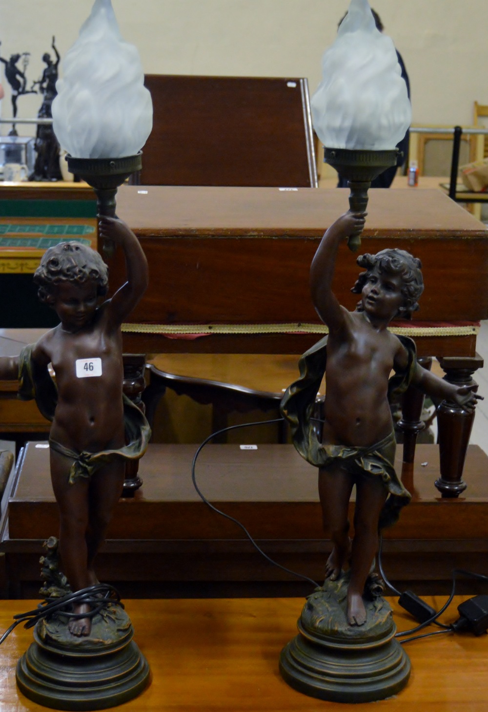 PAIR OF 35" BRONZED CHERUB LAMPS WITH FLAME GLASS SHADES