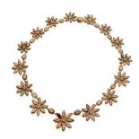 A Victorian garnet set daisy chain necklace the graduated floral links composed of marquise and