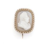 A 19th century carved hardstone cameo brooch depicting a gentleman in profile, in a single border of