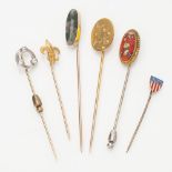 A collection of gem set tie pins to include a moss agate set example, another with yellow metal