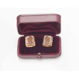 A pair of hardstone intaglio set cufflinks the rectangular carved panels with armoured heads of