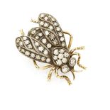 A diamond set novelty brooch modelled in white metal as a moth set throughout with small round cut