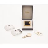 A diamond set cigar cutter modelled in yellow metal, set with small rose cut diamond, with