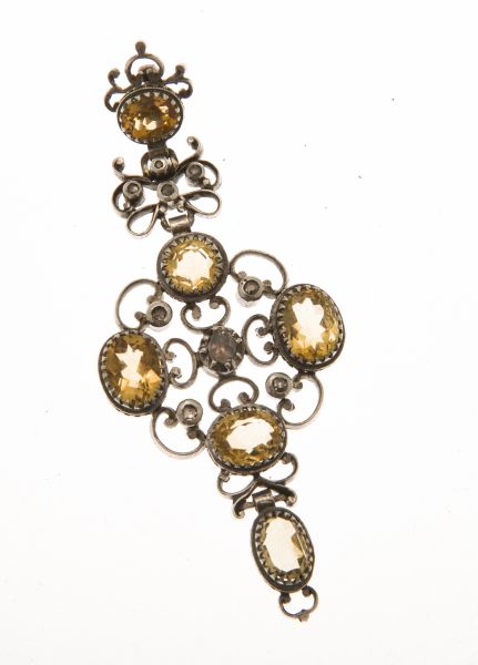 A late 19th century citrine and diamond set pendantmodelled in unmarked white metal, of open