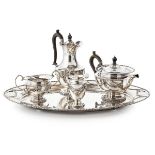 A comprehensive five piece tea service including a matching traySheffield 1921-22, of plain