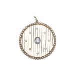 A Belle Epoque pearl and sapphire set pendantof pierced circular design, set throughout with small