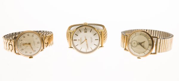 OMEGA, JAEGER LE COULTRE - A group of three wrist watchesSeamaster De Ville model, champagne dial,