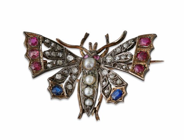 A multi-gem set butterfly broochmodelled in unmarked yellow and white metal, the body set with