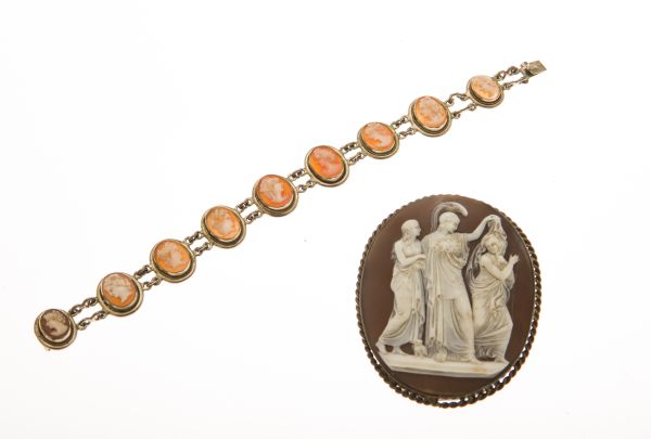 A cameo brooch and braceletthe cameo brooch of large oval form, depicting three classical figures,