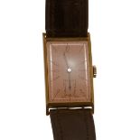 A gentleman's 9ct gold cased wrist watchthe rectangular dial with Arabic numerals and rose