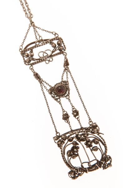 An Arts & Crafts garnet set pendantthe plain silver chain with a small panel of rope twist detail,