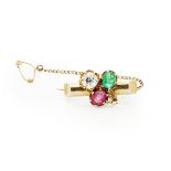 A diamond, emerald and ruby set broochthe yellow metal bar with applied shamrock motif, each leaf