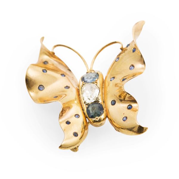 A diamond and sapphire set butterfly broochunmarked, the curved wings set with single cut pale