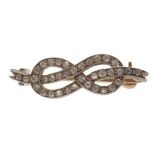 A small all diamond set knot broochset in silver on gold, unmarkedLength: 27mm