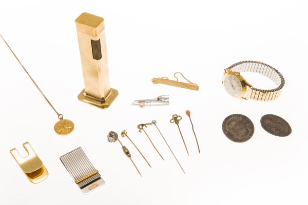 A collection of itemsto include a Dunhill table lighter, various gem set tie pins; Cartier,