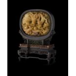 YELLOW-BROWN JADE TABLE SCREENthe jade panel of ovoid form depicting two coiled dragons chasing