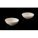 PAIR OF SMALL DING WARE BOWLSPOSSIBLY SONG DYNASTYof circular form, the cream-glazed body moulded to