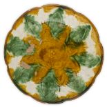 EGG AND SPINACH GLAZED POTTERY DISHPOSSIBLY LIAO DYNASTYthe floriform dish with moulded decoration