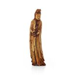 STAINED AND CARVED IVORY FIGURE OF GUANYINQING DYNASTY, 19TH CENTURYstanding with her robe falling