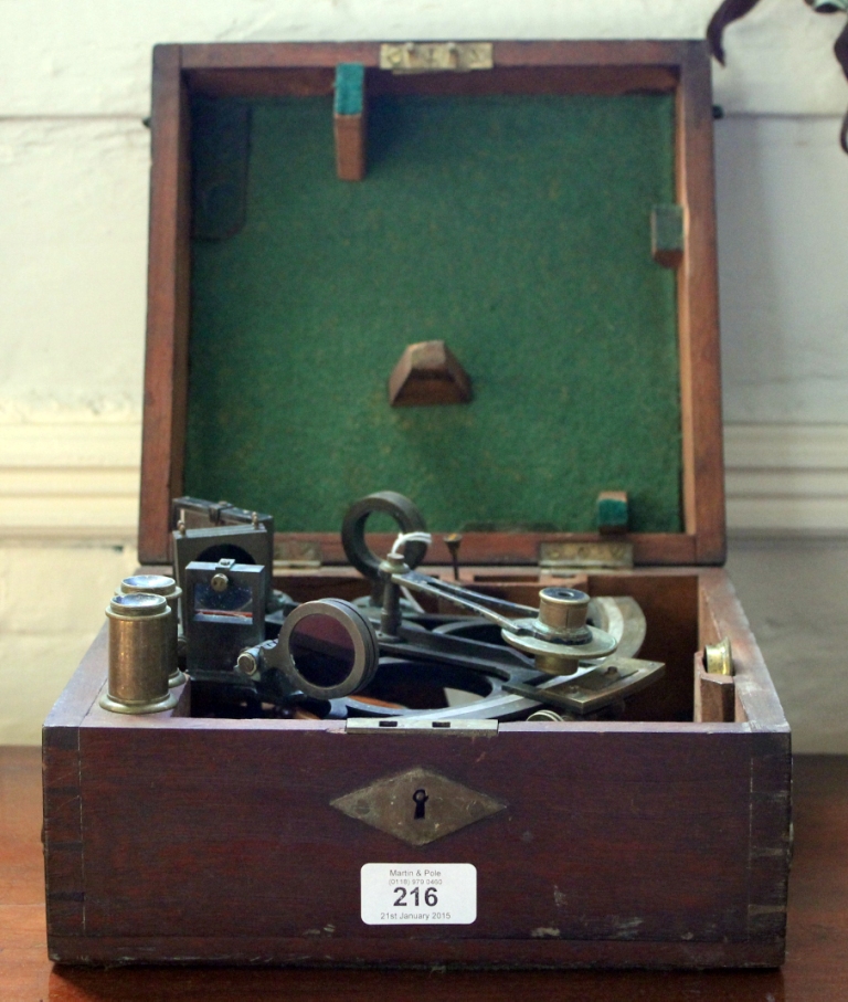 A 19th century brass and metal sextant with accessories in wooden carry box