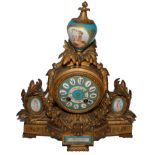 A 19th century French Sevres-style porcelain and gilt bronze mantle clock, the case surmounted by