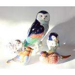 Two Royal Crown Derby bird paper weights, two Bellwood models of owls and a seated dog, unmarked