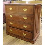 A mahogany chest of two short and three long drawers, shaped top, brass drop handles, pierced back