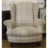 A contemporary John Lewis 'Long Eton Guild Furniture Manufactures' wing back arm chair with