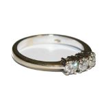 Three stone diamond ring set in 18 carat white gold