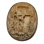 *A brooch set with an ivory carving