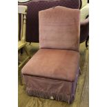 A fabric upholstered nursing or bedroom chair with domed support