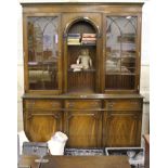 *A Georgian-style mahogany bookcase with dentil frieze, twin astragal doors, shelved interior over
