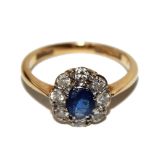 *An 18 carat gold diamond and sapphire cluster ring