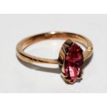A 9 carat gold ring set marquise cut stone, possible tourmaline