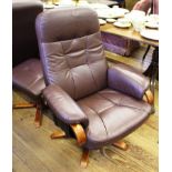 A 'Chairman' Mobel Team (Sweden) leather swivel reclining chair and foot stool with stained hardwood