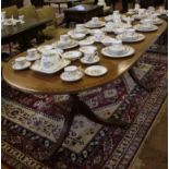 A Regency-style mahogany and cross banded 'D' end extending dining table with ebony string inlay and