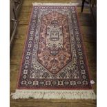 A Royal Keshan pure new wool pile multicoloured floral rug, 137cm x 68cm