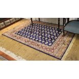 A blue ground Bokhara-design multicoloured floor rug, 240cm x 160cm