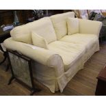 A contemporary drawing room sofa with cream coloured fabric upholstery, 200cm wide