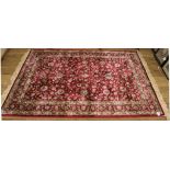 A red ground all over floral design drawing room rug, 200cm x 140cm