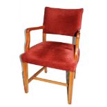 A vintage oak framed library chair with fabric upholstered support and seat, raised on square