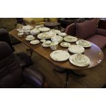 A Regency-style mahogany and cross banded 'D' end extending dining table with fluted rim, raised