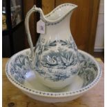 An early 20th century ceramic ewer and bowl with floral and foliate decoration