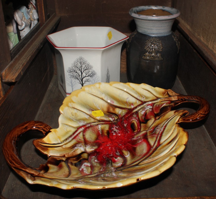 A two handled pottery fruit dish in the shape of a leaf, together with a pottery vase in brown